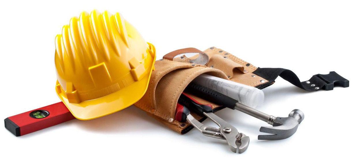 A yellow hard hat and some tools in it.